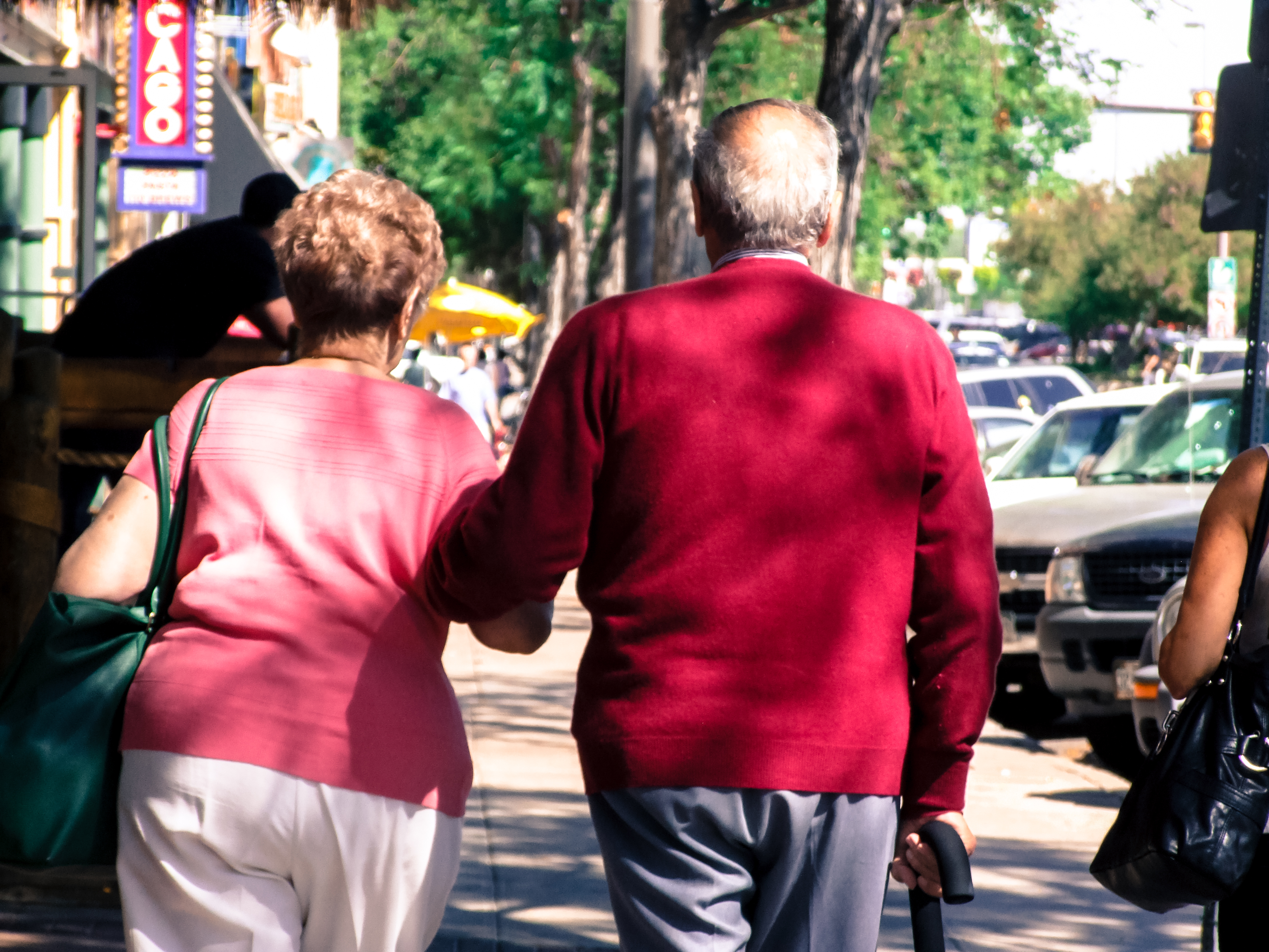 Eldery couple walking hand by hand