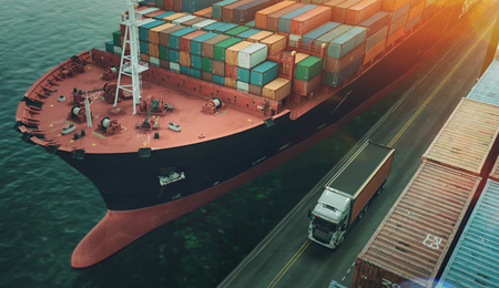 Port, cargo ship with containers, containers on land, truck on route