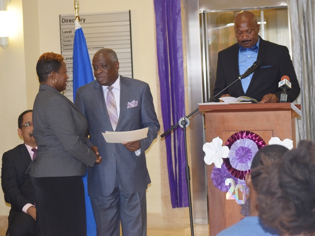 The Chief Justice of Barbados Sir Marston Gibson, presented a certificate of appreciation to the Maria Holder Memorial Trust for their contribution to the Drug Treatment Court, accepting the certificate on the behalf of the Maria Holder Memorial Trust is Ms. Ruchelle Roach Project Manager at the Supreme Court of Barbados Dec 13, 2017(December 13, 2017)